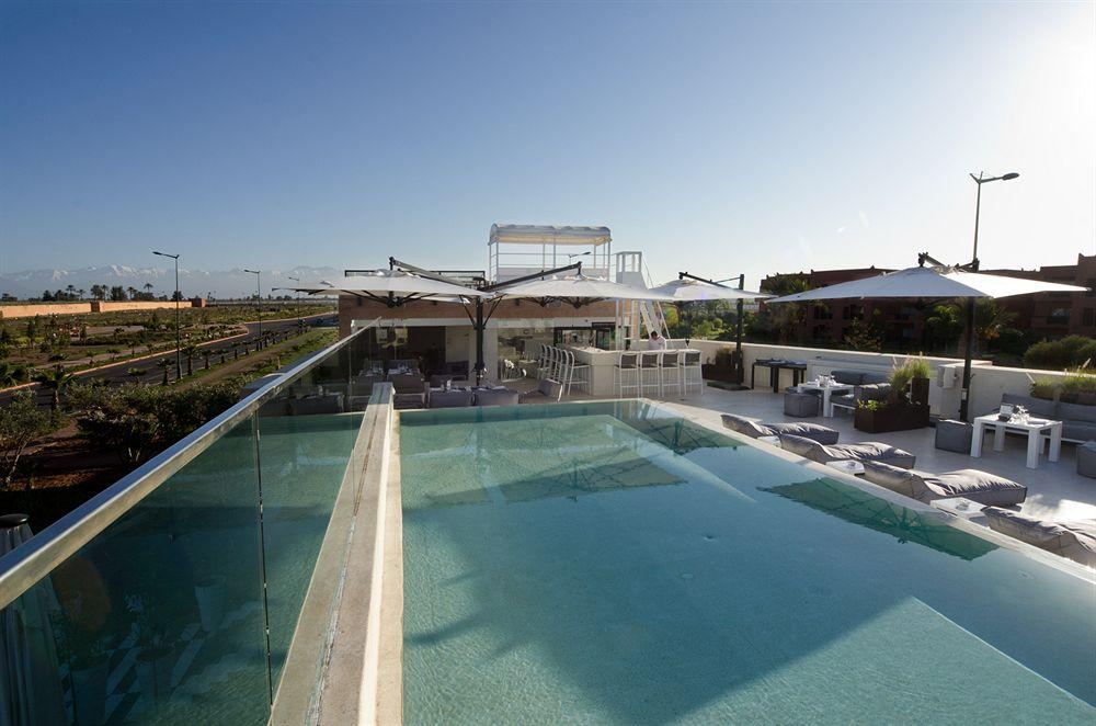 세사르 리조트 앤 스파 마라케시 외부 사진 The rooftop pool at the hotel